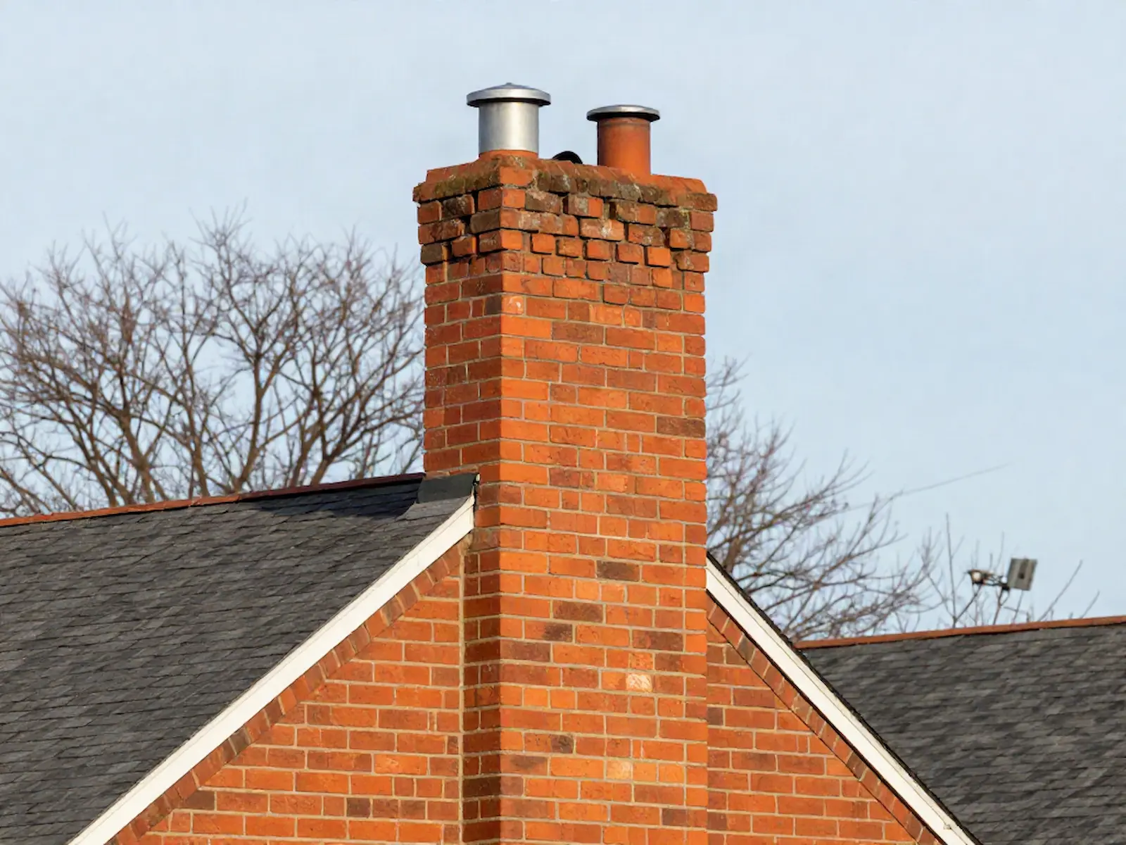 Brick chimney on a home served by Gant & Owens Chimney Service in Philadelphia, PA
